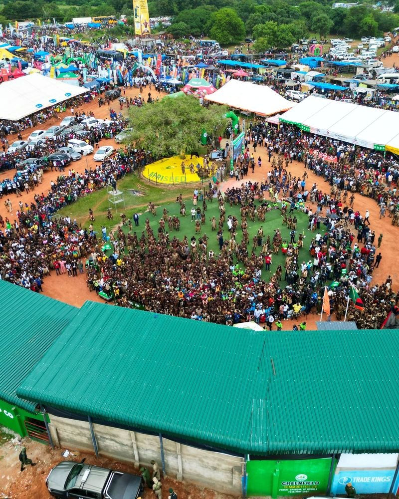 A drone view of a huge crowd gathered around a large traditional dance performance – Largest Traditional Dance Gathering world record idea